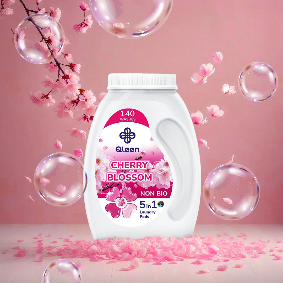 Qleen Cherry Blossom laundry pods with cherry blossoms and bubbles on a pink background