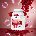 Qleen laundry detergent bottle with roses and bubbles on a pink background